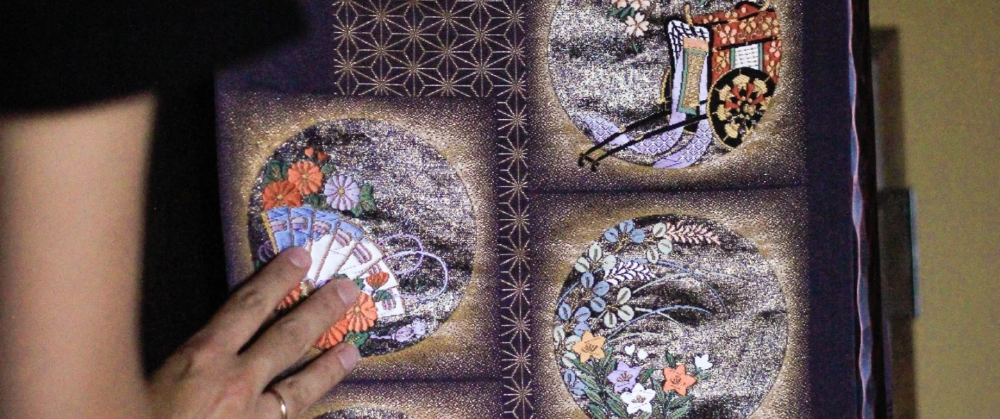 Craft Workshop in Kyoto exploring kimono obi, vintage textiles, and a handmade upcycled pouch.