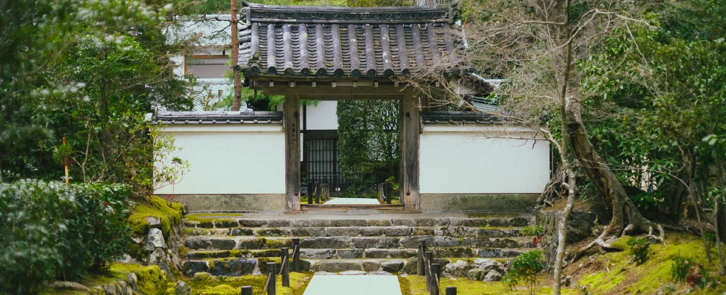 Kyoto walking tour and craft experience in quiet Zen garden and silk obi upcycled into an accessory.