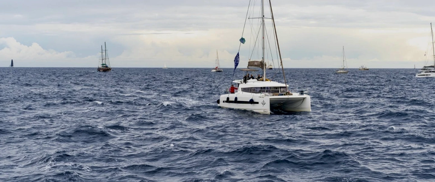 Boat Tour in Barcelona in a luxury catamaran, cook paella onboard, and share a long Catalan lunch.