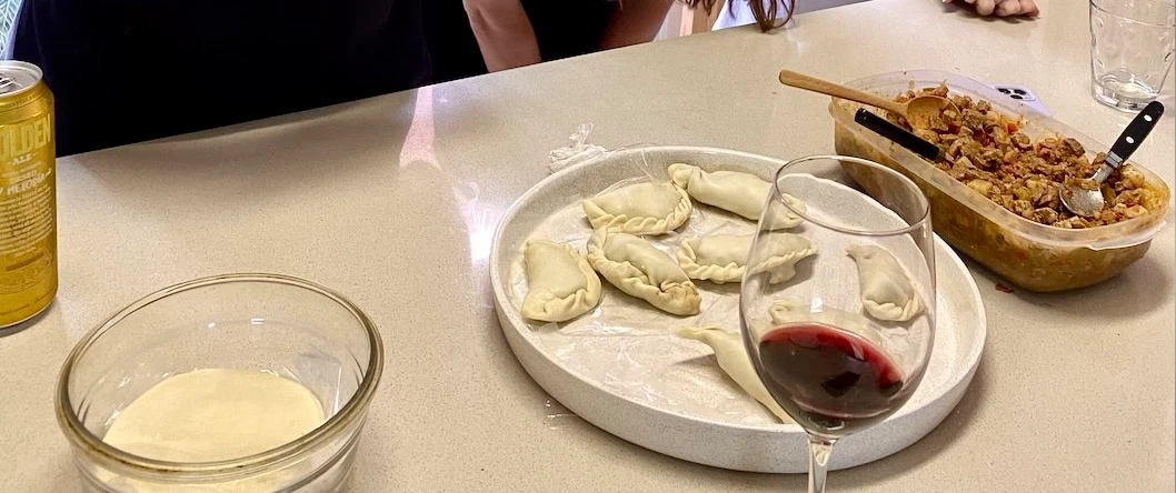 Cooking Class in Buenos Aires making Argentine empanadas in a local home, with wine and dessert.