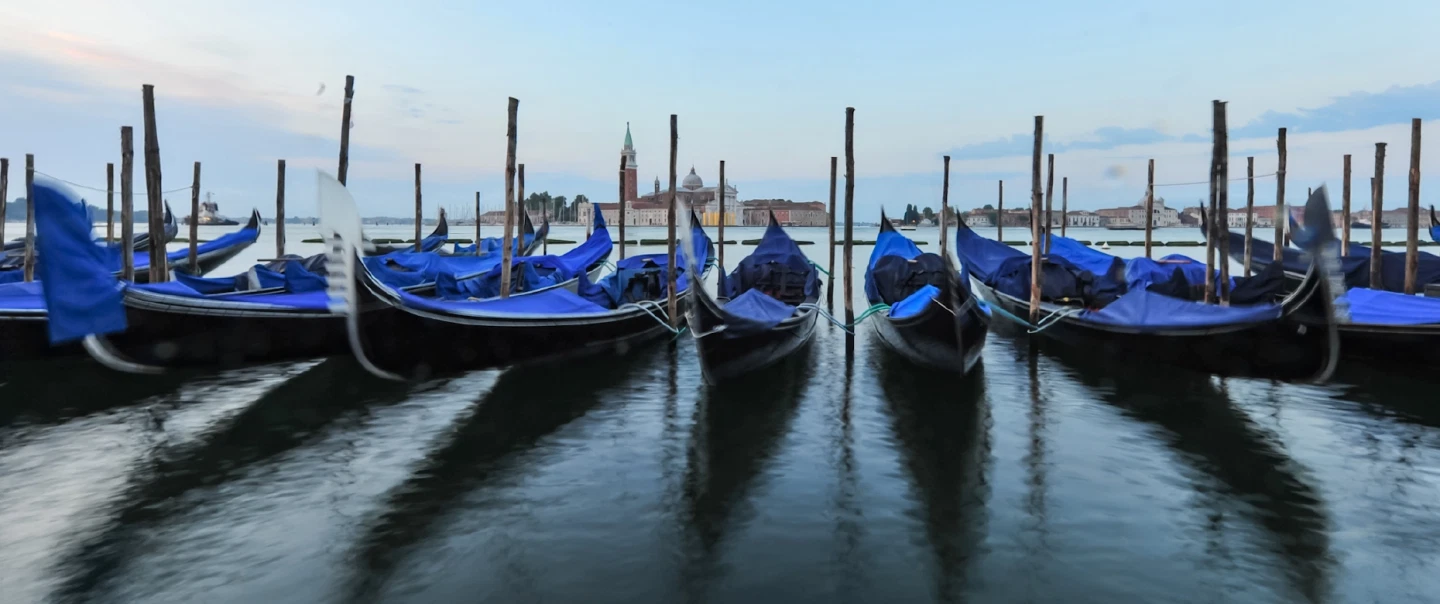 Walking Tour in Venice at sunrise through Piazza San Marco, quiet calli, and Rialto Market.