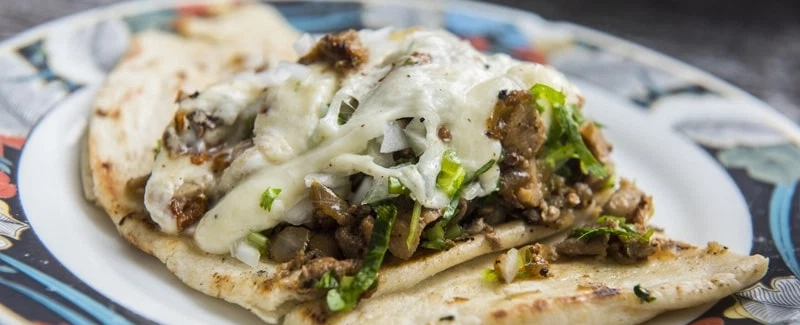 Food Tour in Mexico City: Taste iconic tacos & tortillas at Medellín Market with a culinary expert.