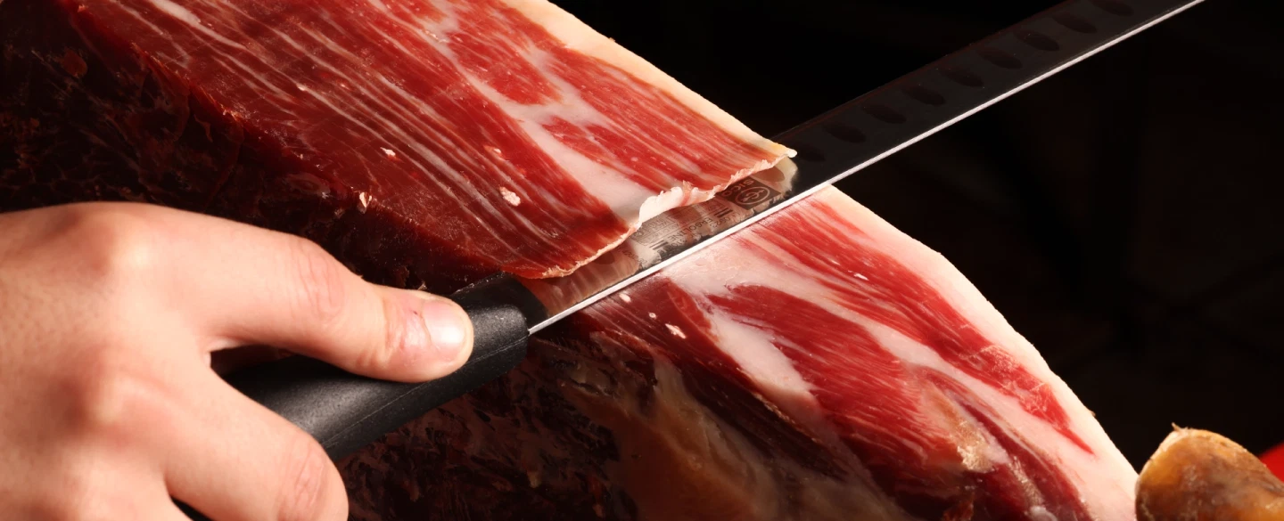 Culinary Workshop in Madrid with Iberian ham slicing, artisan cheese, and regional wine pairings.