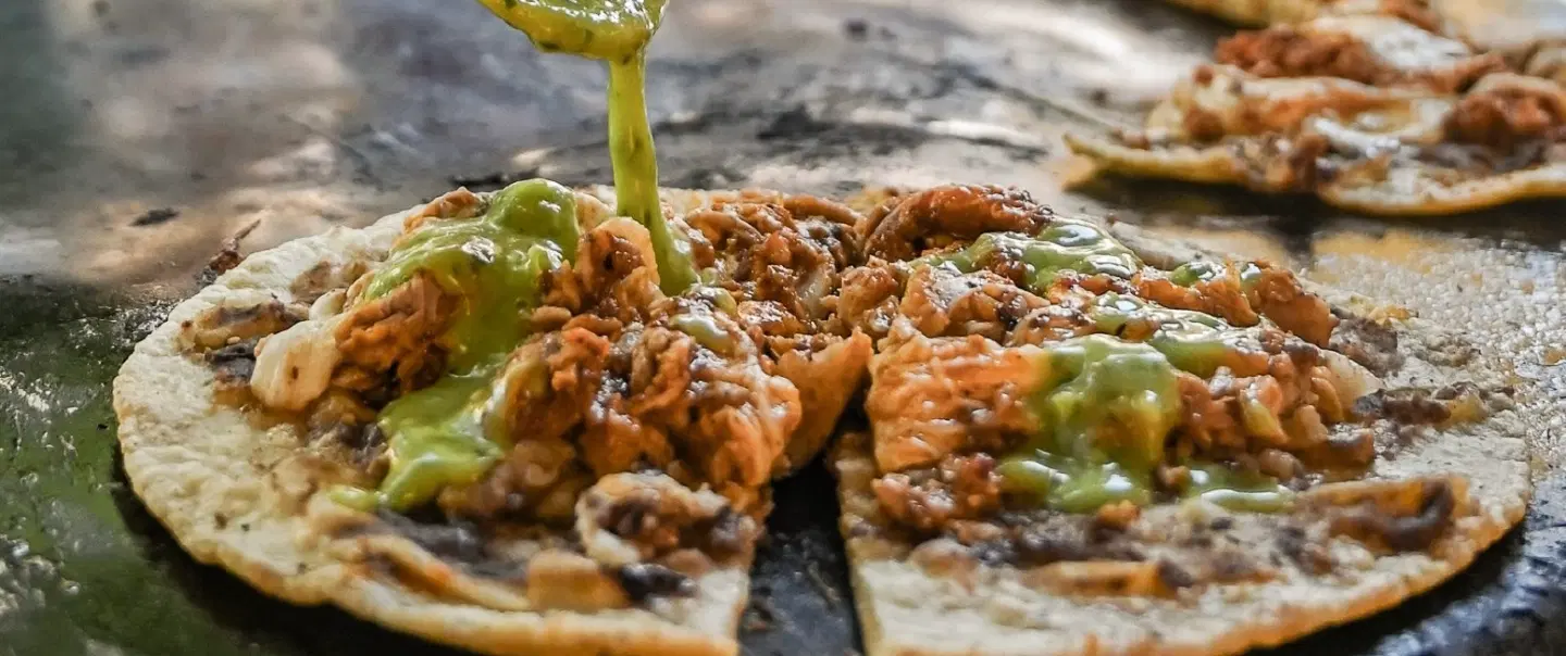 Walking Tour in Oaxaca exploring markets, traditional street food, tejate, and local food culture.