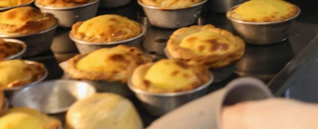Cooking workshop in Lisbon: bake pastéis de nata with grandmothers in an intergenerational kitchen.