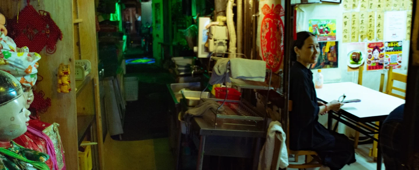Tokyo night street photography tour in Shinjuku's neon-lit alleys with a documentary photographer.