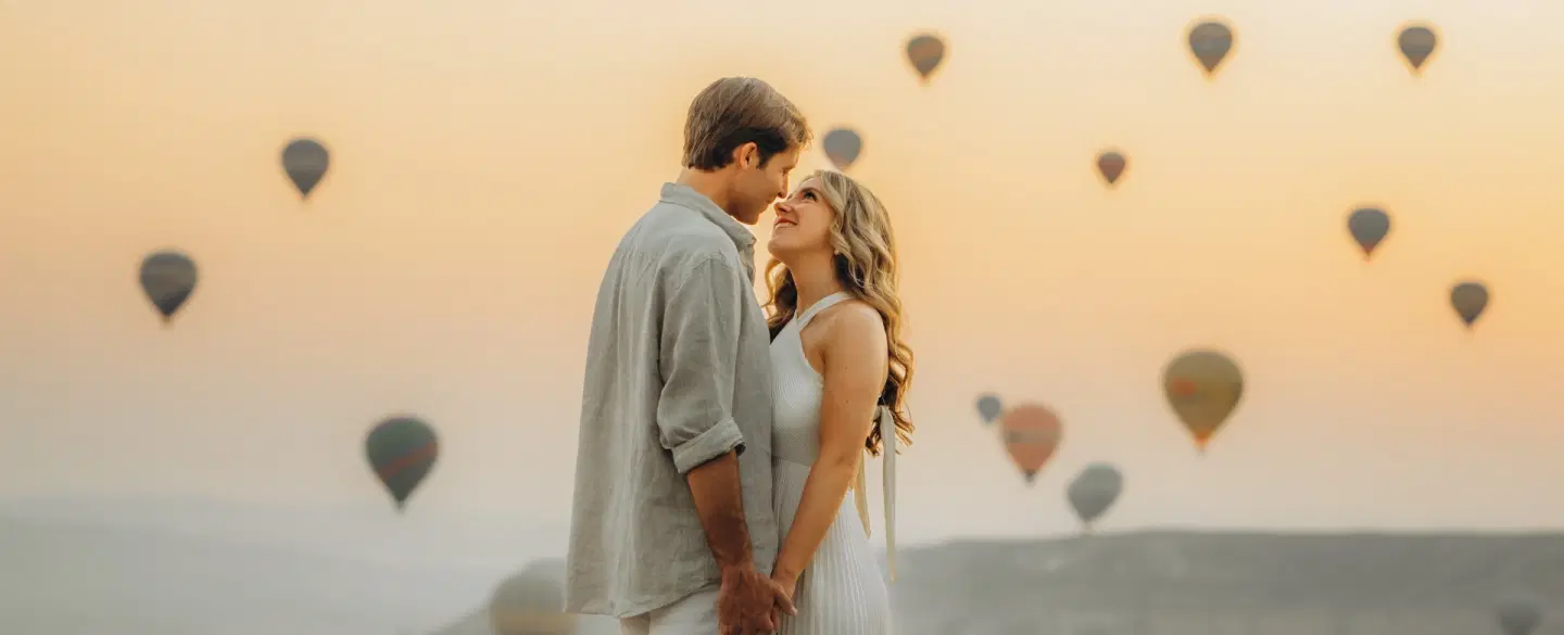 Photoshoot in Cappadocia at sunrise with hot air balloons, caves, valley views, expert photographer.