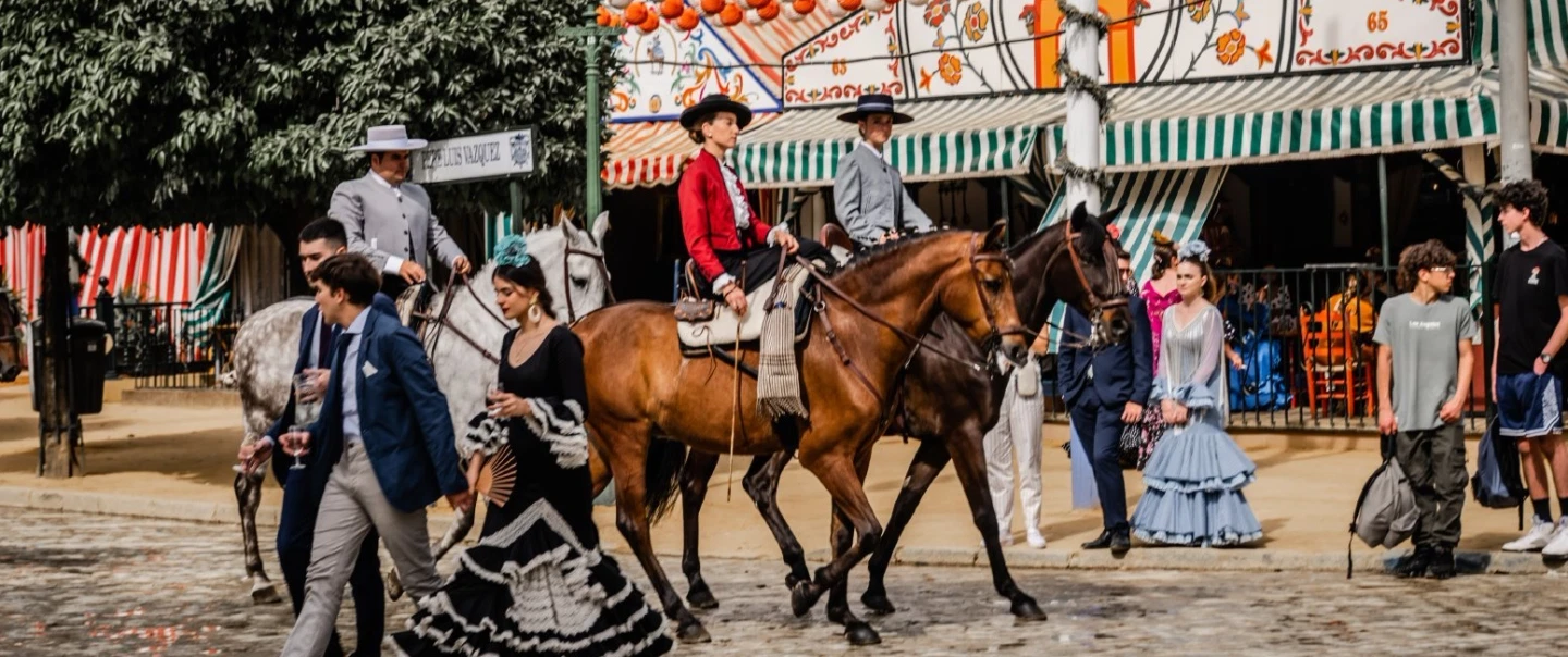 Feria de Abril Tour in Seville: dance class, flamenco styling, carriage ride, private caseta access.