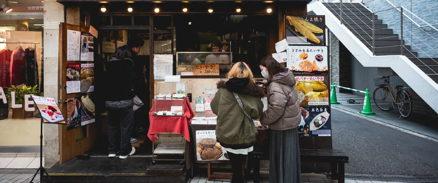 Walking Tour in Tokyo’s Asagaya exploring shotengai shops, okonomiyaki, and a standing sake shop.