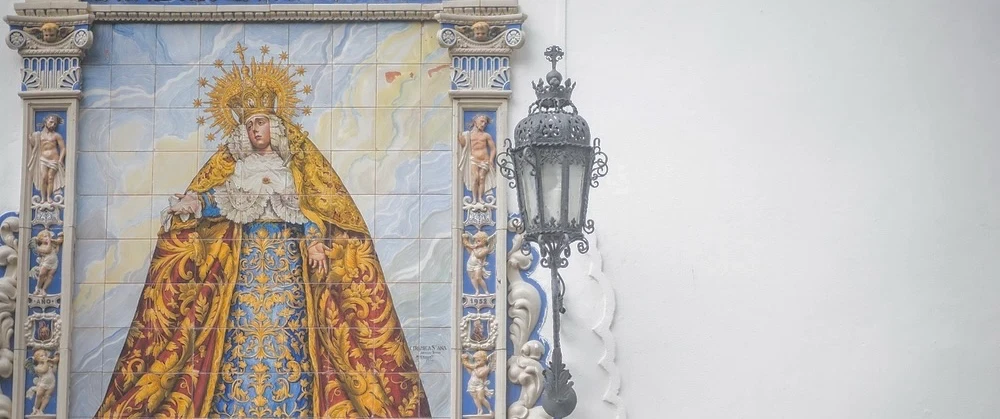 A Jerez day with a brotherhood host — sacred embroidery workshop, sherry-house lunch, two Camarines.