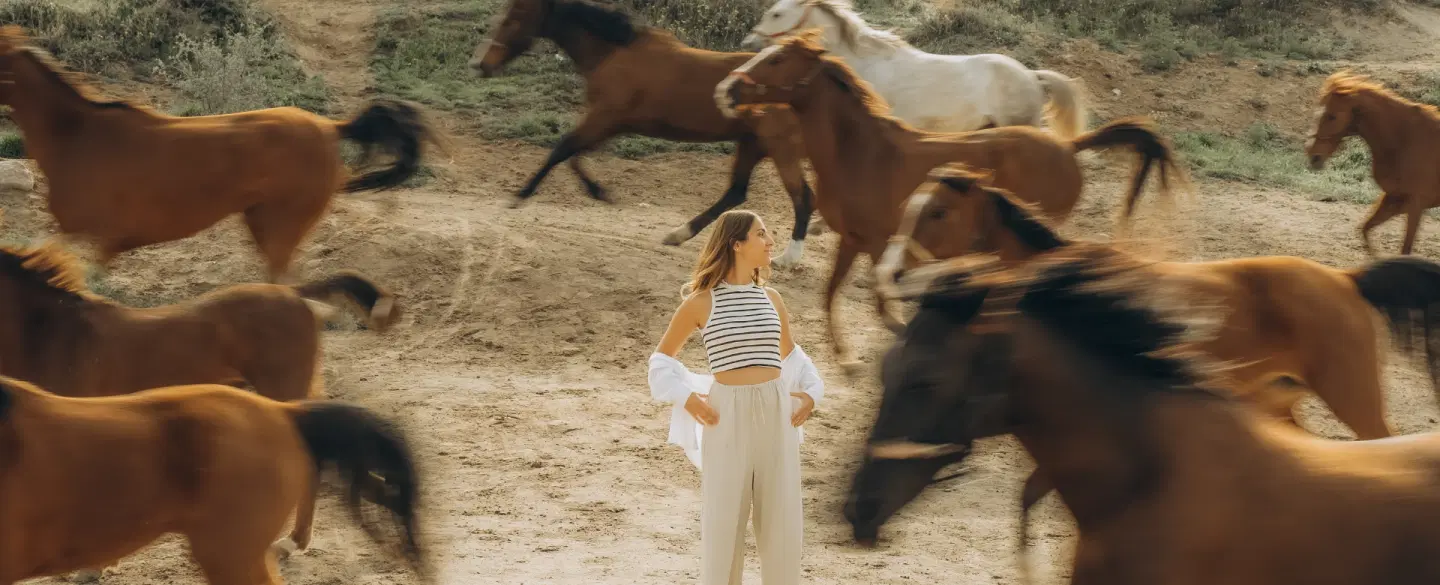Portrait Photoshoot in Cappadocia with wild horses, dramatic landscapes, and expert photographer.