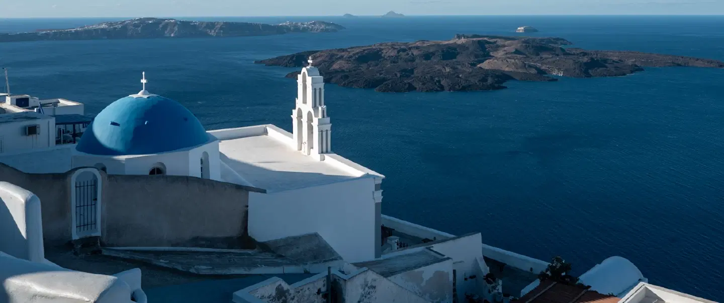 Island Tour in Santorini with curated sightseeing in the morning and shared Aegean sunset cruise.