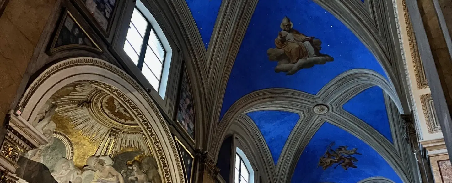 Walking Tour in Rome exploring starry ceilings and artistic treasures inside historic churches.