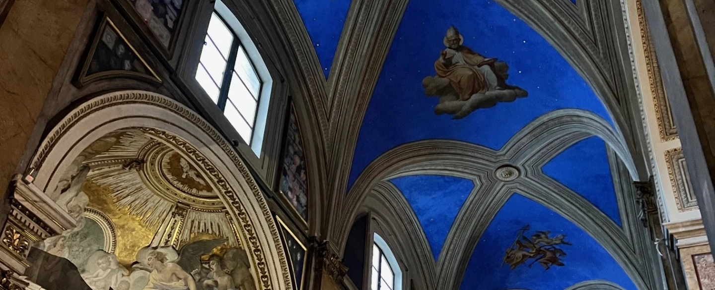 Walking Tour in Rome exploring starry ceilings and artistic treasures inside historic churches.