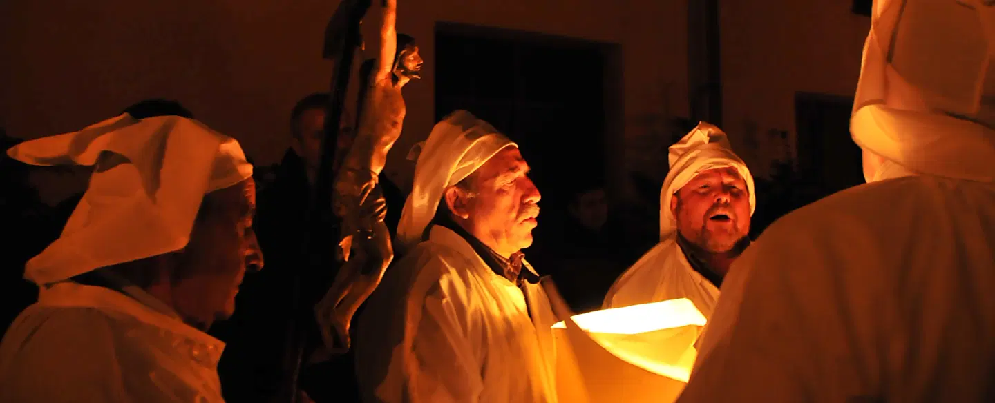 Holy Week Photo Experience in Castelsardo, Sardinia with Lunissanti torchlit procession and chants.