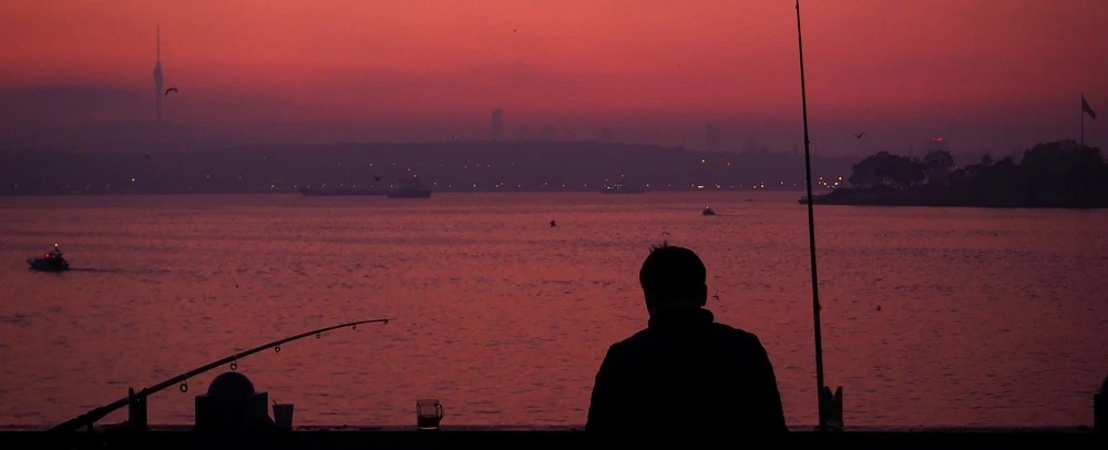 Sunrise Photo Walk in Istanbul: Galata Bridge, blue hour to golden hour, Bosphorus views, fishermen.