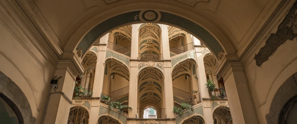 History Tour in Naples' Sanità walking Fontanelle ossuary, Baroque palaces, faith and folk devotion.